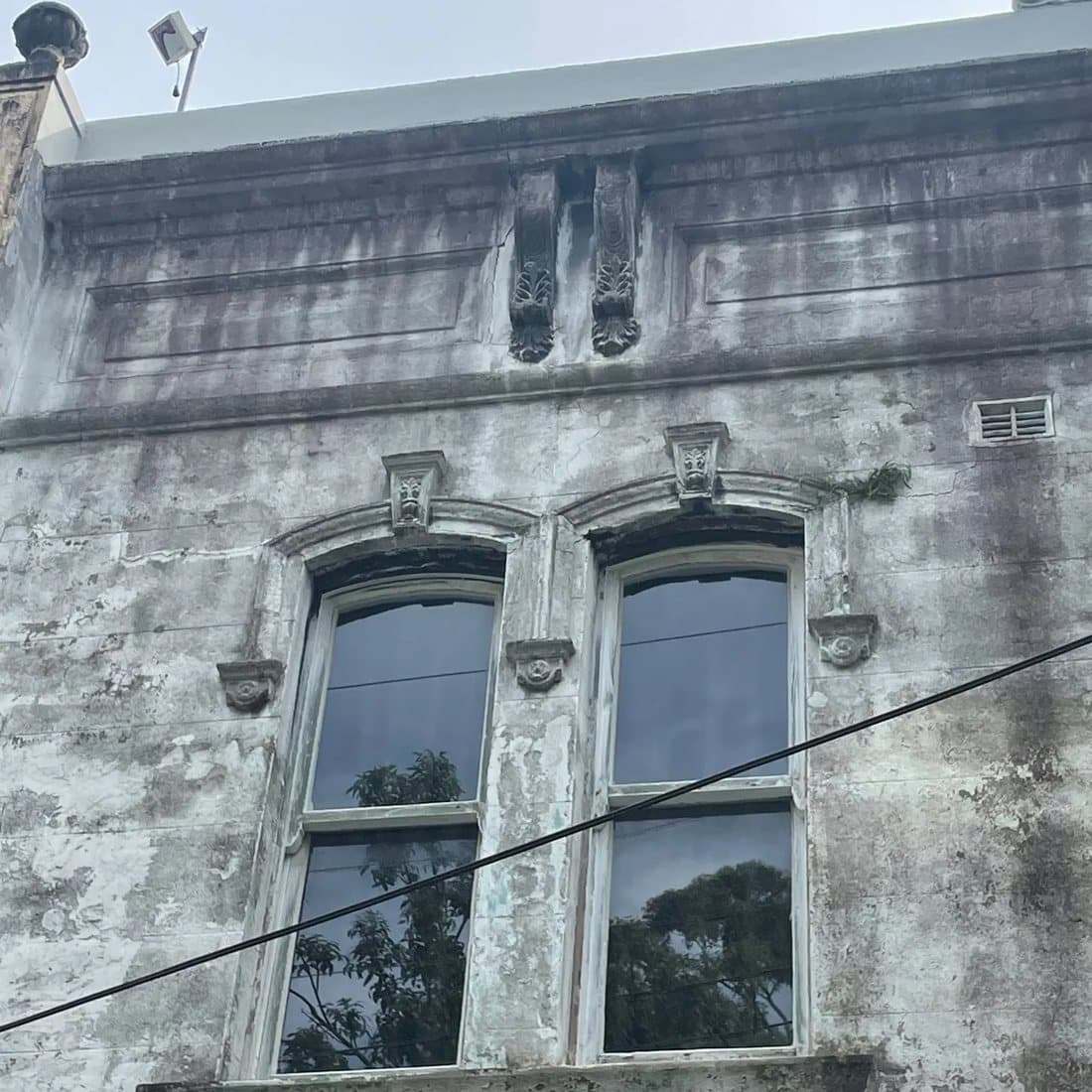 Heritage facade with rendered arched windows